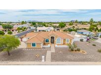 Charming home boasts a well-maintained desert landscape, tile roof, and welcoming facade in a desirable neighborhood at 4622 E Ellis Cir, Mesa, AZ 85205