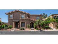 Inviting home featuring a red tile roof, low-maintenance desert landscaping, and classic architectural details at 10420 N 10Th St # 2, Phoenix, AZ 85020