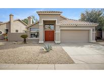 Charming single-story home with a well-manicured, desert landscape and a two car garage at 115 W El Freda Rd, Tempe, AZ 85284