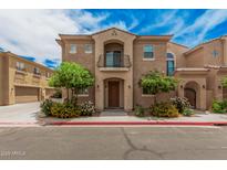 Beautiful two-story home boasts a lovely balcony and well-maintained landscaping at 1367 S Country Club Dr # 1327, Mesa, AZ 85210