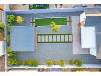 Aerial view of backyard oasis featuring a bocce court, pavers, and a charming shaded seating area at 1513 E Sheridan St, Phoenix, AZ 85006