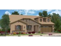 Charming single-Gathering home featuring a stone facade, a 2-car garage, and neatly landscaped front yard at 23036 E Oriole Way, Queen Creek, AZ 85142