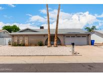 Charming single story home with brick accents, desert landscaping, and attached two car garage at 4062 W Mescal St, Phoenix, AZ 85029