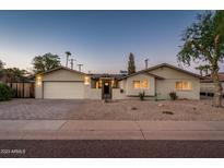 Charming single-story home with desert landscaping, a paver driveway, and inviting curb appeal at 8408 E Rancho Vista Dr, Scottsdale, AZ 85251