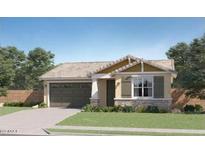 Charming single-story home with a two-car garage, covered entryway, and landscaped front yard at 16714 W Audrey Ln, Surprise, AZ 85387
