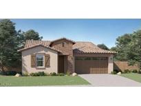 Charming one-story home featuring a brick entryway, tile roof, two-car garage, and well-maintained front yard at 16739 W Charlotte Dr, Surprise, AZ 85387
