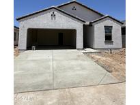 Charming single-story home featuring stucco siding, an attached two-car garage, and a concrete driveway at 1960 E Bucking Bronco Dr, San Tan Valley, AZ 85140