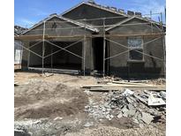 View of a home under construction with scaffolding and building materials in the front yard at 1960 E Bucking Bronco Dr, San Tan Valley, AZ 85140