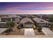 Beautiful single-story home featuring desert landscaping and a two-car garage in a quiet neighborhood at 31051 W Amelia Ave, Buckeye, AZ 85396