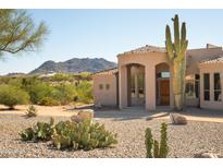 Desert home featuring manicured landscape with native cacti and beautiful mountain views at 35108 N 139Th Way, Scottsdale, AZ 85262
