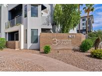 Inviting exterior of condo building with desert landscaping and brick signage at 3633 N 3Rd Ave # 1035, Phoenix, AZ 85013