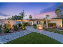 Charming single story home with manicured landscaping and inviting walkway at 6310 E Desert Cove Ave, Scottsdale, AZ 85254