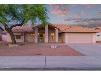 Charming single-story home featuring a well-maintained front yard and two-car garage at 7833 S Kenneth Pl, Tempe, AZ 85284