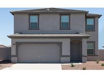 Charming two-story home with a two-car garage and neutral-colored exterior at 15515 W Deanne Dr, Waddell, AZ 85355