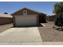 Charming single-story home with a well-maintained front yard and a two-car garage, perfect for a Gathering at 15729 W Lundberg St, Surprise, AZ 85374