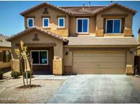 Charming two-story home with a tile roof, manicured landscaping, and a two-car garage at 2628 W Jasper Butte Dr, San Tan Valley, AZ 85144