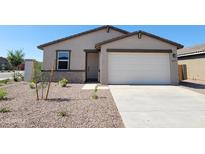 Charming single-story home featuring a neutral color palette, two-car garage, and low-maintenance landscaping at 3557 E Audrey Dr, San Tan Valley, AZ 85143