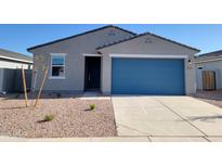 Charming single-story home featuring a blue garage door, low-maintenance landscaping, and modern design elements at 3660 E Audrey Dr, San Tan Valley, AZ 85143