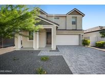 Charming two-story home featuring a two-car garage, a well-maintained front yard, and a welcoming entrance at 4615 S 23Rd Way, Phoenix, AZ 85040