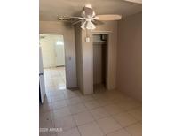 Bedroom featuring tile flooring, ceiling fan, and closet at 527 S Macdonald --, Mesa, AZ 85210