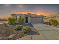 Inviting single-story home with a well-maintained landscape and neutral-toned facade at 7580 W Darrel Rd, Laveen, AZ 85339