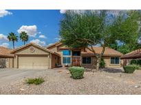Charming single-story home with desert landscaping, a two-car garage, and a welcoming front entrance at 9004 S Ash Ave, Tempe, AZ 85284