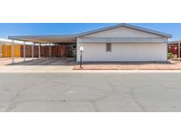 Charming single-story home featuring a covered parking area and low-maintenance landscaping at 10951 N 91St Ave # 222, Peoria, AZ 85345