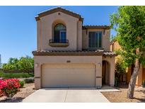 Charming two-story home with a neutral color palette, well-manicured landscaping, and a two car garage at 1547 W Lacewood W Pl, Phoenix, AZ 85045