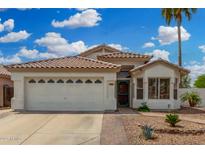 Charming single-story home featuring a two-car garage and a well-maintained desert landscape at 1653 E Gail Dr, Chandler, AZ 85225