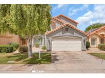 Inviting single-Gathering home with mature landscaping, a spacious driveway, and a convenient two-car garage at 16622 S 32Nd Pl, Phoenix, AZ 85048