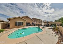 Inviting backyard pool with lounge area perfect for relaxing and entertaining, featuring ample space at 21968 W Hadley St, Buckeye, AZ 85326