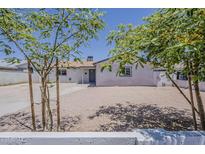 Charming single-story home featuring low maintenance landscaping and an inviting front entrance at 3017 N 46Th Dr, Phoenix, AZ 85031
