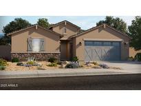 Charming single-Gathering home with stone accents, a two-car garage, and desert landscaping at 37114 W La Paz St, Maricopa, AZ 85138