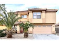 Charming two-story home boasts a classic design, desert landscaping, and a spacious two-car garage at 574 W Racine Loop, Casa Grande, AZ 85122