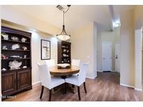Cozy dining room featuring a round table, stylish chairs, and built-in display cabinets at 8500 E Southern Ave # 510, Mesa, AZ 85209