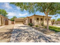 Inviting single-story home with a neutral color scheme, tile roof and desert landscaping at 948 E Savannah Dr, Chandler, AZ 85225