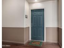 Condo front door is painted a sleek blue-gray with a modern six-panel design at 9820 N Central Ave # 321, Phoenix, AZ 85020