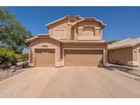 Charming two-story home features a 3-car garage, desert landscaping, and tile roof at 1125 S Larkspur St, Gilbert, AZ 85296