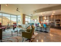 Bright living room boasts marble floors, an open layout, and a stunning view of Camelback Mountain at 140 E Rio Salado Pkwy # 1006, Tempe, AZ 85281