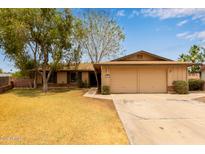 Charming single-story home featuring a two-car garage and mature landscaping in a suburban setting at 1874 E Huntington Dr, Tempe, AZ 85282