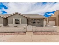 Charming home featuring a decorative brick wall and a well-manicured front yard at 2929 E Broadway Rd # 30, Mesa, AZ 85204