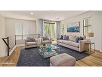 Inviting living room featuring stylish furniture, decor, and abundant natural light at 4236 N 27Th St # 37, Phoenix, AZ 85016