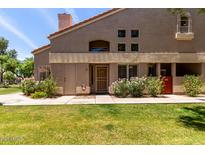 Inviting front entrance with a well-maintained lawn and mature landscaping at 500 N Roosevelt Ave # 26, Chandler, AZ 85226