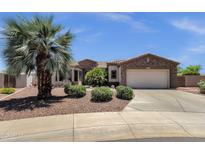 Charming home featuring desert landscaping, stone accents, and a spacious two-car garage at 5342 S Citrus Ct, Gilbert, AZ 85298
