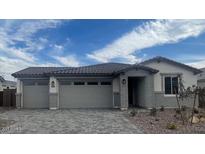 Charming single-story home with a three-car garage and beautiful brick accents at 12381 W Marguerite Ave, Avondale, AZ 85323