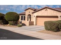 Beautiful single-Gathering home featuring a well-maintained exterior, neutral stucco, and a two-car garage at 17111 S 180Th Ln, Goodyear, AZ 85338