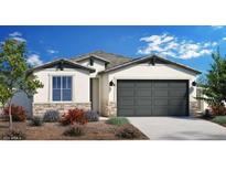 Charming single-Gathering home featuring a neutral palette, stone accents, two-car garage, and manicured landscaping at 17312 W Dahlia Dr, Surprise, AZ 85388