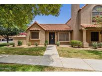 Charming home with a classic design, tiled roof, and well-manicured front lawn at 3491 N Arizona Ave # 118, Chandler, AZ 85225