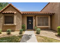 Inviting home entrance featuring a decorative welcome sign and tidy landscaping at 3491 N Arizona Ave # 118, Chandler, AZ 85225
