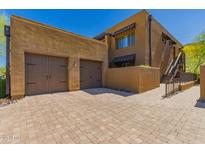 Inviting home featuring a multi-car garage and a charming, rustic exterior at 36600 N Cave Creek Rd # C7, Cave Creek, AZ 85331